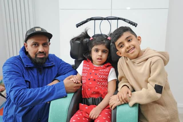 Saffa Shehzan (centre) with dad Majid and brother Isa, seven.