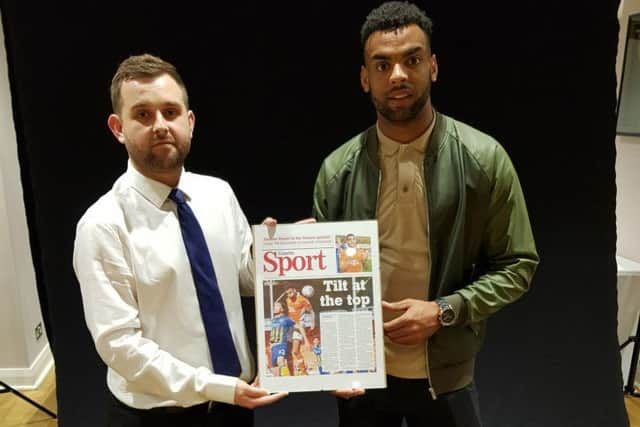 Tilt is presented with his award by Blackpool FC writer Matt Scrafton