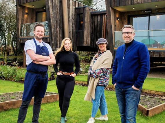 Cartford Inn, Little Eccleston, Lancashire. Owners Patrick and Julie Beaume with daughter Jeanicia Beaume and head chef Chris Bury in front of the new studio chalets