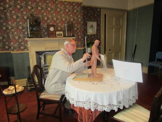 Artist Alan Ward with a working mini-model of his statue of Sir Peter Hesketh-Fleetwood