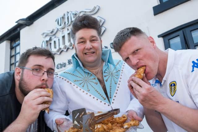 Fish and Chip challenge at the Cottage chippy, Blackpool. Challenge winners Gordon Stuteley (left) and Jamie Brighty with Elvis tribute Eddie P.