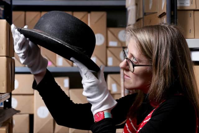 Karry Vasilou from Blackpool Council's cultral services team, with a bowler hat that belonged to comedy hero Stan Laurel (Picture: Lorne Campbell/Guzelian)