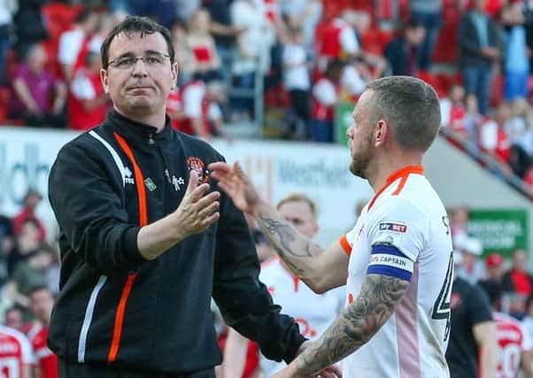 Blackpool manager Gary Bowyer shakes the hand of Jay Spearing after the match