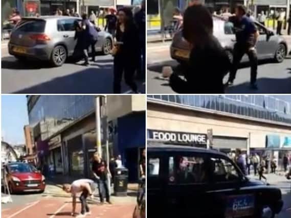 One person, in a convention-related shirt, appeared to take a motorist's keys before shoving him after the driver got out his VW to retrieve them (Pictures: Alex Miklos)