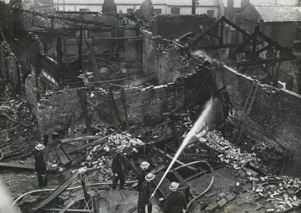 Firefighters tackle the blaze at the Earl's Court amusement centre,
Blackpool, on February 13, 1944