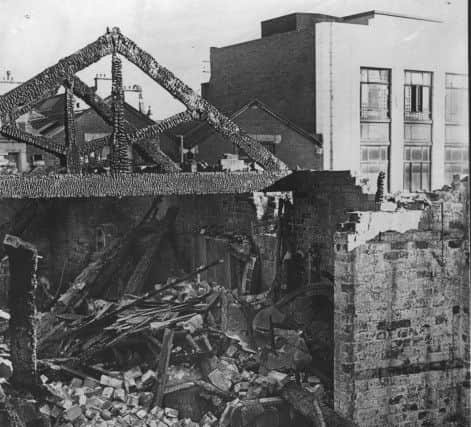 A close-up picture of some of the blackened ruins left by the destructive fire at Earl's Court fun-fair in Church Street, Blackpool, February 1944.
Note the bumper car in the foreground.