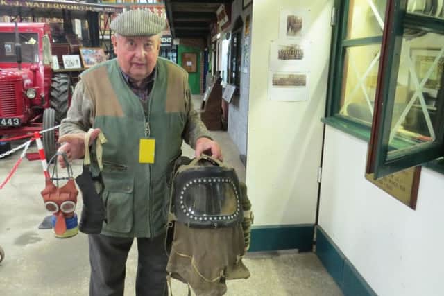 Lancashire historian John Higginson holds an air raid siren