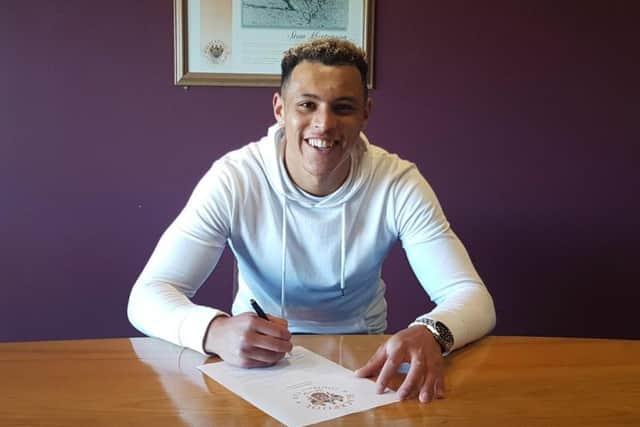 Boney, 20, signs his new deal