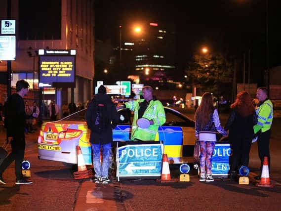 Emergency services at Manchester Arena after reports of an explosion at the venue during an Ariana Grande gig. Photo credit: Peter Byrne/PA Wire