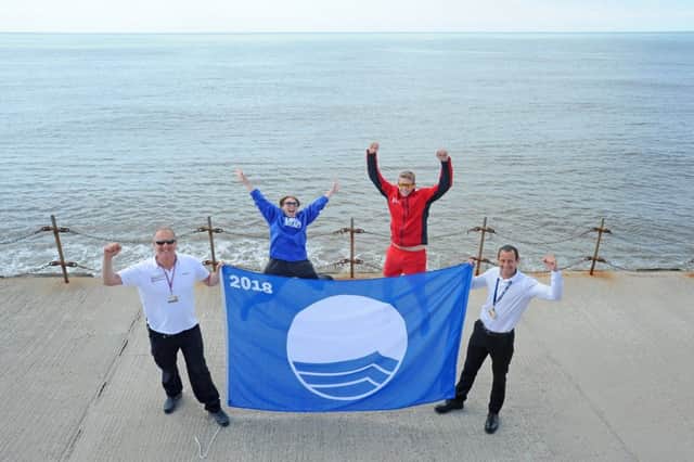 South Shore beach has been awarded the blue flag award for 2018.  Pictured are Beach Patrol manager Rick Williams, Emma Whitlock from Fylde LoveMyBeach, Beach Patrol officer Sam Taylor and street cleanising operations manager Gavin Macpherson.