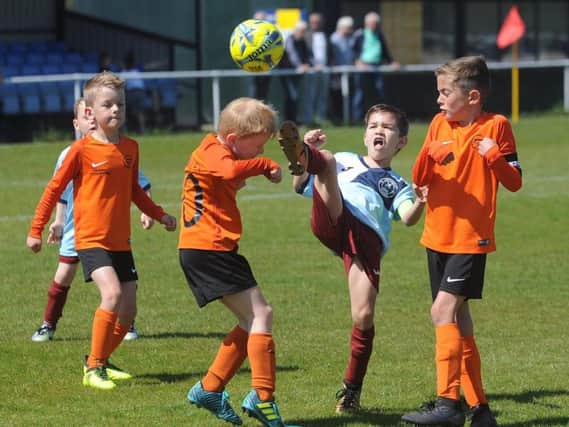 Under-7 Hogan Cup final action between Lytham and YMCA
