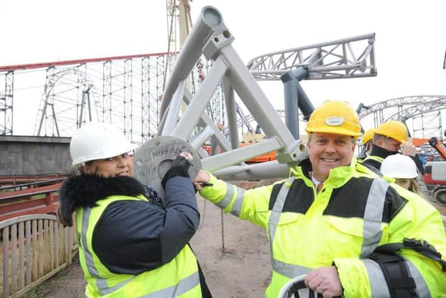 Amanda and Nick Thompson sign the final piece of Icon as it was put into place back in February