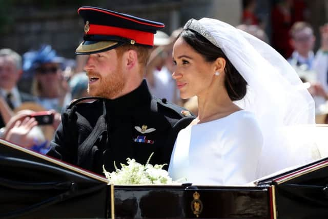 Meghan Markle and Prince Harry leave St George's Chapel at Windsor Castle after their wedding. PIC: PA