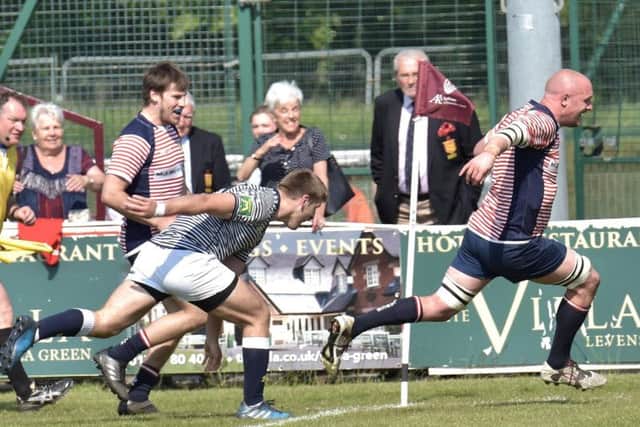 Former Fylde winger Anthony Bingham scores one of his three tries for Lancashire