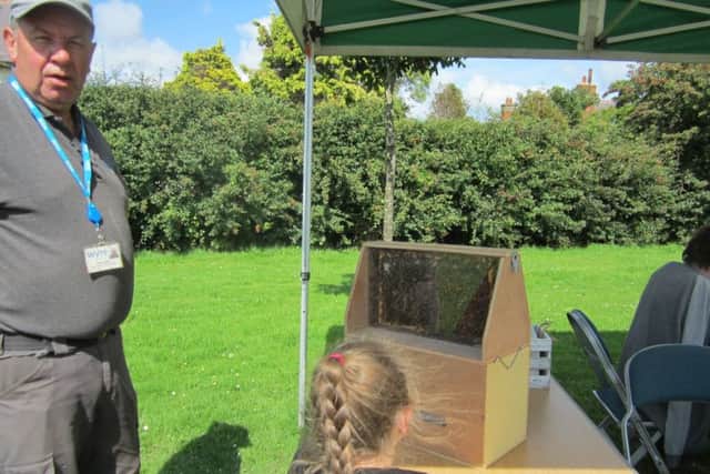 Ranger Keith Urwin shows off the hive