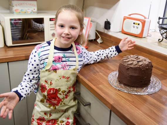 Grace Smith with one of her cakes