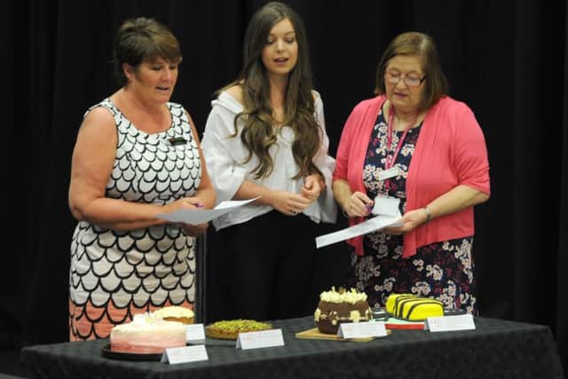 GBBO star Katie Lyon judges a baking competition at Blackpool Sixth Form college in aid of Trinity Hospice.  She is pictured with catering manager Sue Flynn and Sheila Swann from Trinity Hospice.