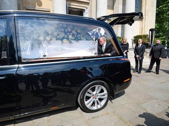 The coffin of Supermarket Sweep star Dale Winton is loaded into a hearse outside Old Church, 1 Marylebone Road in London, after his funeral service. Photo credit: Kirsty O'Connor/PA Wire
