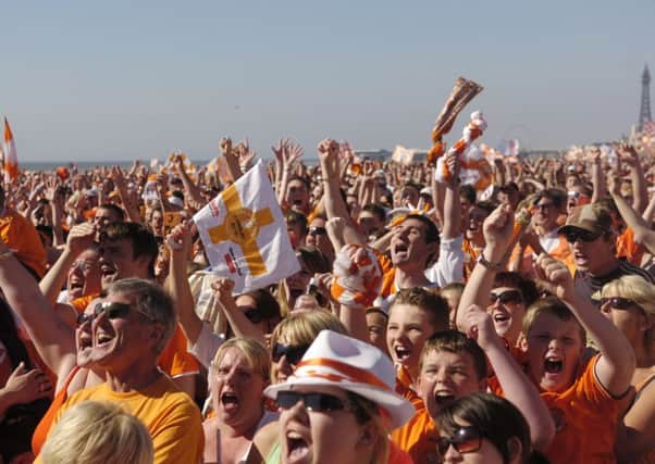 Blackpool fans celebrate their promotion to the Premier League on the promenade back in 2010