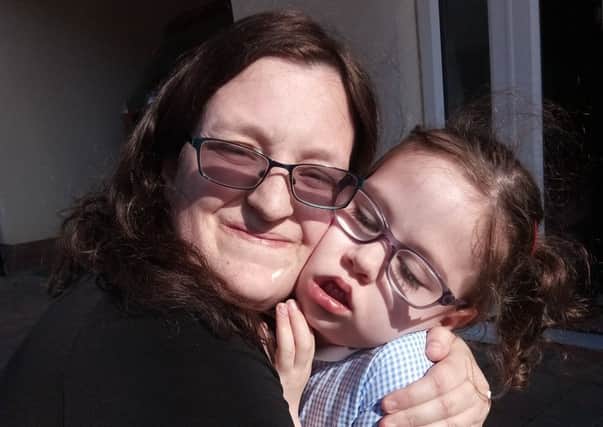 Freya Butterfield, who has myotonic dystrophy, with her mum Joanne McCabe
