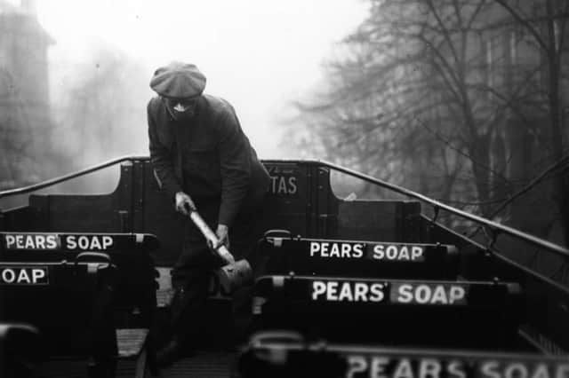 A man spraying the top of a bus with an anti-flu virus during the Spanish flu epidemic (Photo: Davis/Getty Images)
